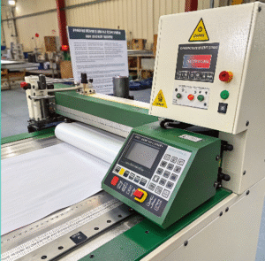Velcro cutting machine in an industrial setting designed with energy-efficient components to reduce electricity usage during operation.