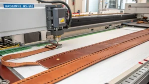 Italian leather workshop featuring HAOXINHE HX-680 cutter working on leather straps with precision and efficiency.
