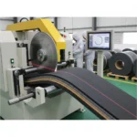 Industrial rotary bevel belt cutter with workers in factory setting